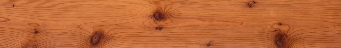 A single warm reddish-brown cedar deck board with straight grain and small tight knots