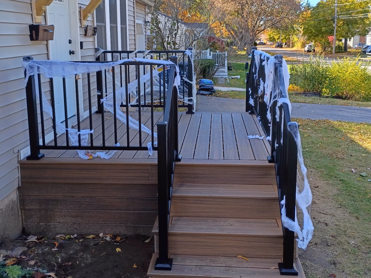 Havana Gold Trex deck boards and stairs with black aluminum railings in South Burlington VT