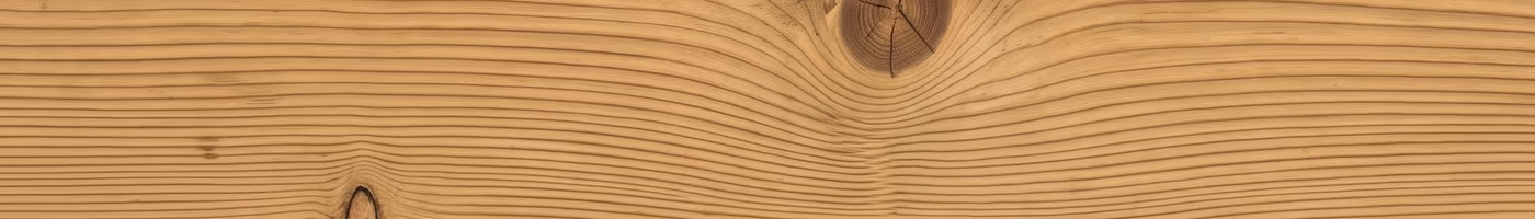 A single pale golden pressure-treated pine deck board with straight grain and one dark knot