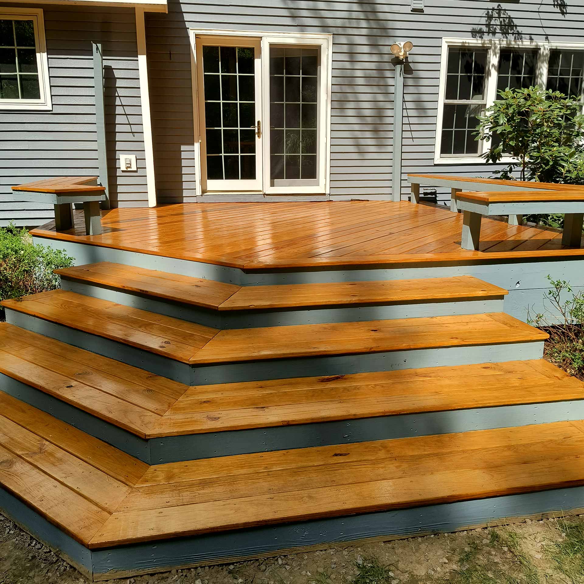 Newly renovated porch with vinyl siding on house